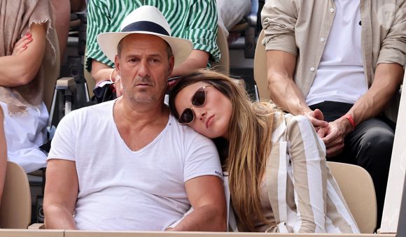 Roger Erhart et sa compagne Delphine Wespiser, Miss France - Célébrités dans les tribunes des internationaux de France de Roland Garros à Paris. © Cyril Moreau - Dominique Jacovides/Bestimage