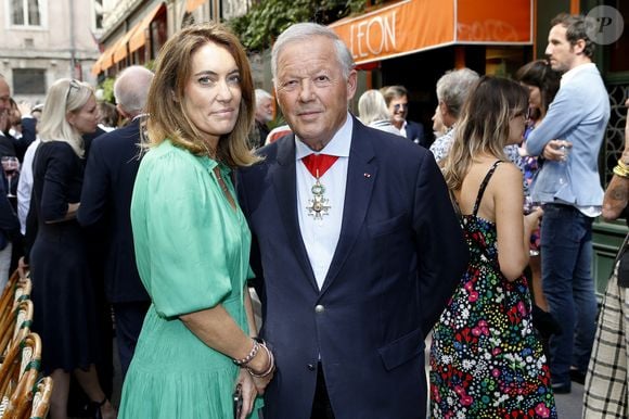 Le chef étoilé Georges Blanc avec sa compagne Sara - Laurent Gerra reçoit les insignes de Chevalier dans l’ordre du Mérite Agricole des mains de Monsieur Georges Blanc, chef triplement étoilé, au Restaurant Léon de Lyon à Lyon, France, le 3 septembre 2023. © Pascal Fayolle/Bestimage