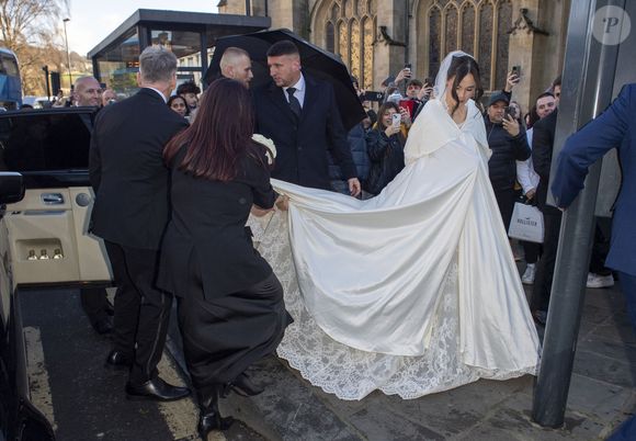 Holly Ramsay a épousé un champion olympique de natation.

Arrivées pour le mariage de Holly Ramsay avec Adam Peaty à l'abbaye de Bath., le 27 décembre 2025. GOFF  / BESTIMAGE