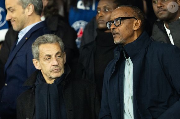 Nicolas Sarkozy, Paul Kagame (Président de la république du Rwanda) - Célébrités dans les tribunes du match de 8ème de finale aller de la Ligue Des Champions 2025-2026 (LDC) "PSG - Chelsea (5-2)" au Parc des Princes à Paris le 11 mars 2026. © Cyril Moreau/Bestimage