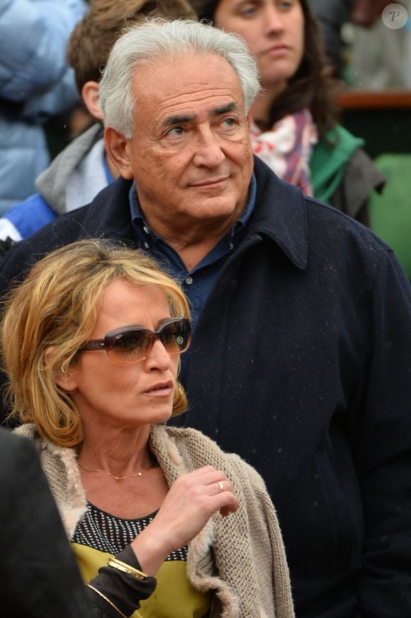 Dominique Strauss-Kahn et sa compagne Myriam L'Aouffir assistent à la finale féminine entre l'Américaine Serena Williams et la Russe Maria Sharapova lors des Internationaux de France de Tennis 2013 au stade Roland-Garros à Paris, France, le 8 juin 2013. Williams a gagné 6-4, 6-4. Photo Jeremy Charriau/ABACAPRESS.COM