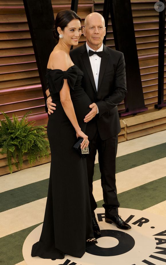 Bruce Willis et sa femme Emma Heming (enceinte) - People à la soirée Vanity fair après les Oscars 2014 à West Hollywood. Le 2 mars 2014. Action Press / Bestimage