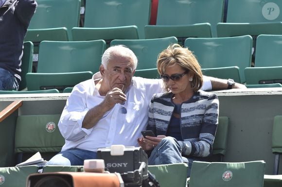 Dominique Strauss Kahn et sa petite amie Myriam L'Aouffir assistant aux Internationaux de France de Tennis à Roland Garros à Paris, le 30 mai 2015.