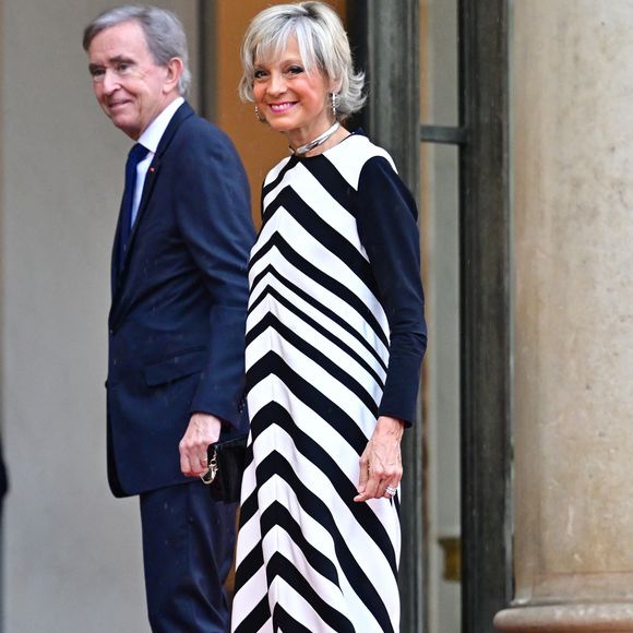 "Il y a pas d’histoires de deux familles, c’est une famille recomposée où il y a cinq enfants Arnault, c’est la famille Arnault."

Bernard Arnault, Pdg de LVMH et sa femme Hélène Mercier - Arrivées des personnalités au dîner d'État en l'honneur du président brésilien et de sa femme au palais présidentiel de l'Élysée à Paris le 5 juin 2025.

© Christian Liewig / Bestimage
