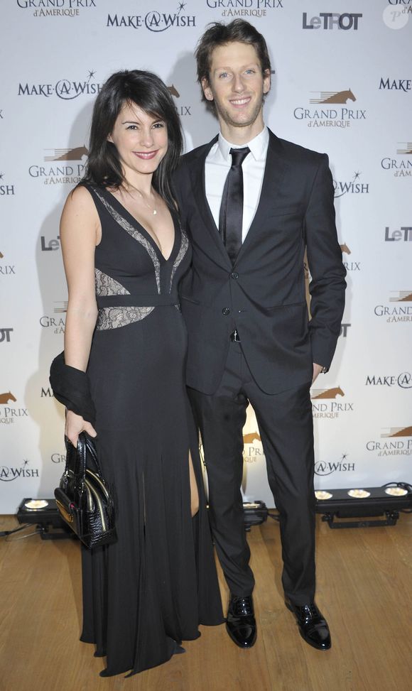 Romain Grosjean et sa femme Marion Jolles enceinte - Diner de Gala du 92eme Grand Prix d' Amerique au Grand Palais a Paris le 26 Janvier 2013. AGENCE / BESTIMAGE
