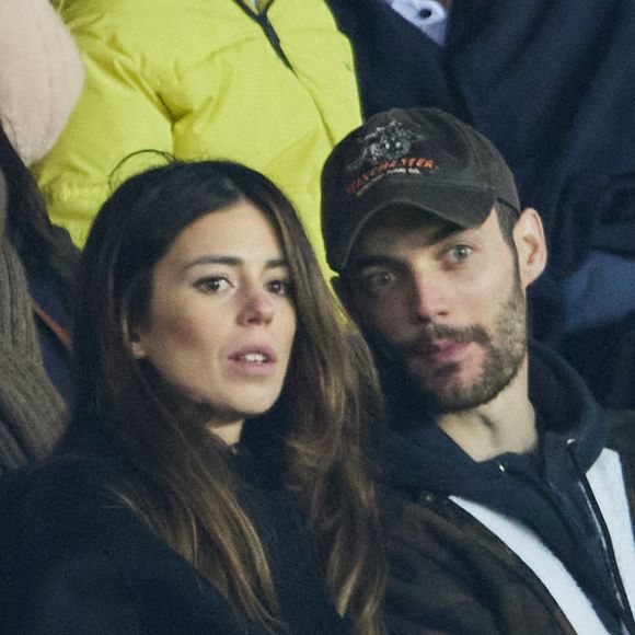 Exclusif - Louis Sarkozy et sa femme Natali Husic   - People en tribunes du match de Ligue 1 Uber Eats "PSG contre Reims" (1-1) au Parc des Princes à Paris le 29 janvier 2023. AGENCE / BESTIMAGE