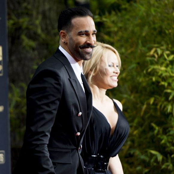 Adil Rami et sa compagne Pamela Anderson arrivent à la 28ème cérémonie des trophées UNFP (Union nationale des footballeurs professionnels) au Pavillon d'Armenonville à Paris, France, le 19 mai 2019. Panoramic / Bestimage