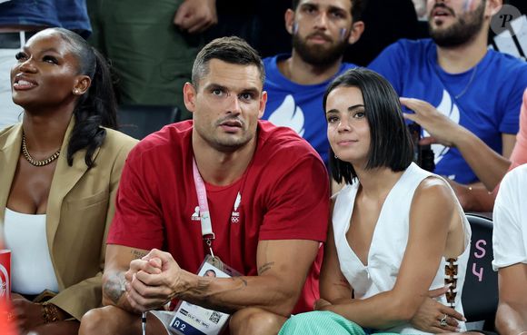 Florent Manaudou et sa compagne Lola Duménil - Les célébrités assistent à la victoire de l'équipe de France de basket face au Canada (82-73) lors des Jeux Olympiques de Paris2024, le 6 août 2024. © Jacovides-Perusseau / Bestimage