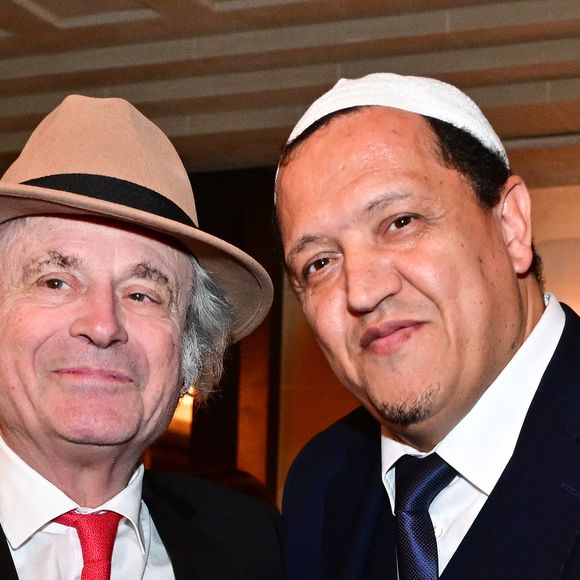 Franz-Olivier Giesbert et Hassen Chalghoumi au dîner annuel du CCAF (Conseil de coordination des associations arméniennes de France) à l'hôtel du collectionneur à Paris le 11 mars 2025
Comme chaque année, la onzième édition du désormais fameux dîner du CCAF a fait salle comble. 450 personnes se sont retrouvées dans les salons de l'hôtel du collectionneur, à Paris. Lors du cocktail, plusieurs personnalités politiques ont eu l'occasion de s'entretenir avec les invités.
Comme de coutume, un certain nombre de figures intellectuelles étaient également au dîner.
C'est Nelson Monfort qui a présenté la soirée en rappelant que la soirée est l'occasion de nous retrouver et de réaffirmer les liens profonds qui unissent la France et l'Arménie, liens tissés par l'histoire, la culture et des valeurs communes.
Cette soirée incarne à la fois un hommage solennel et un appel à l'action. Hommage envers celles et ceux qui oeuvrent sans relâche pour la cause arménienne; mais appel à la communauté internationale pour qu'elle s'engage résolument pour la justice et la paix.

© Christian Liewig / Bestimage