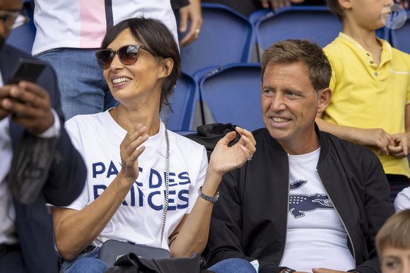 Daniel Riolo et sa compagne Géraldine Maillet - People en tribune lors de la rencontre de football Paris Saint Germain PSG contre Clermont (4-0) au Parc des Princes à Paris le 11 septembre 2021