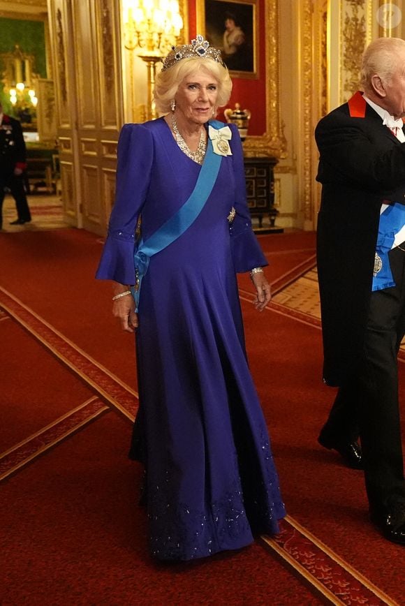 Elle portait une longue robe bleue Fiona Clare et un chapeau Philip Treacy.

Donald J. Trump (président des Etats-Unis) et la Première dame Melania Trump, le roi Charles III d'Angleterre et Camilla Parker Bowles, reine consort d'Angleterre, le prince William, prince de Galles, et Catherine (Kate) Middleton, princesse de Galles, lors du banquet d'Etat au chateau de Windsor en l'honneur de la visite officielle de président Donald Trump et de la Première dame Melania au Royaume-Uni. © PA Photo/ Bestimage