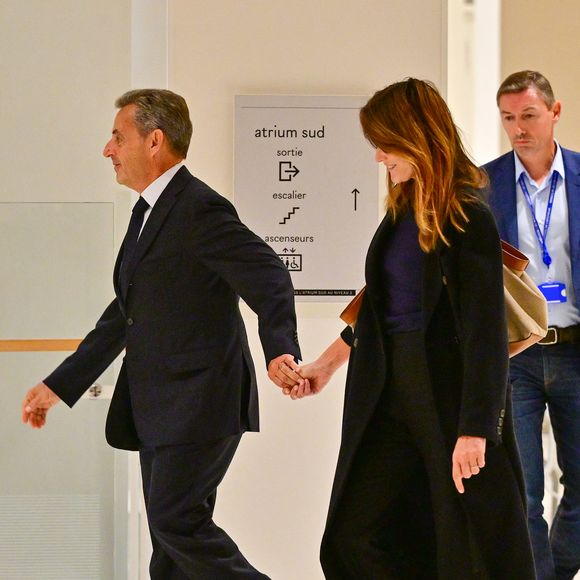 Nicolas Sarkozy et sa femme Carla Bruni au Tribunal judiciaire (Batignolles, 32ème chambre correctionnelle) pour l'annonce de la décision dans le cadre du procès Lybien le 25 septembre 2025.
Nicolas Sarkozy est déclaré coupable d'association de malfaiteurs mais relaxé des autres chefs d'accusation.

© Christian Liewig / Bestimage