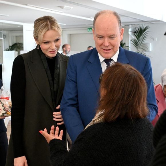 Le prince Albert II de Monaco, sa femme la princesse Charlene et Camille Gottlieb ont remis les traditionnels colis de Noël aux aînés monégasques dans la meeting room du Yacht Club de Monaco dans le cadre de festivités de fin d'année de la Principauté de Monaco, le 12 décembre 2024. © Bruno Bebert/Pool Monaco/Bestimage