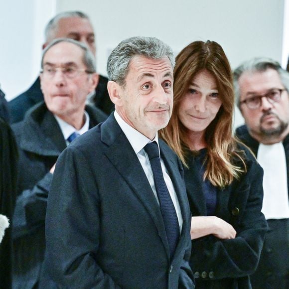 Nicolas Sarkozy et sa femme Carla Bruni - Nicolas Sarkozy condamné à 5 ans de prison à l'issue du procès de l'affaire du financement libyen au tribunal correctionnel de Paris, le 25 septembre 2025. L'ancien chef de l'Etat était accompagné de sa femme, C.Bruni. Nicolas Sarkozy, jugé coupable d’association de malfaiteurs, sera prochainement convoqué en vue de lui signifier la date de son incarcération. 
© Christian Liewig / Bestimage