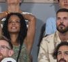 Très impliqué, le compagnon de Christina Milian a activement retravaillé le logo, le merchandising et l'expérience spectateurs.

Matt Pokora  et sa femme Christina Milian dans les tribunes lors des Internationaux de France de Tennis de Roland Garros 2026. Paris, le 25 mai 2026.

© Moreau / Jacovides / Bestimage