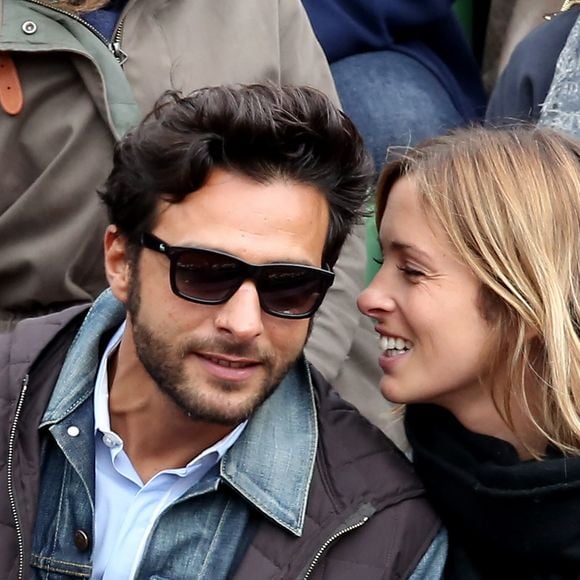 Maxim Nucci (Yodelice) et sa compagne Isabelle Ithurburu dans les tribunes des Internationaux de France de tennis de Roland Garros à Paris. Le 24 mai 2016 
© Dominique Jacovides / Bestimage