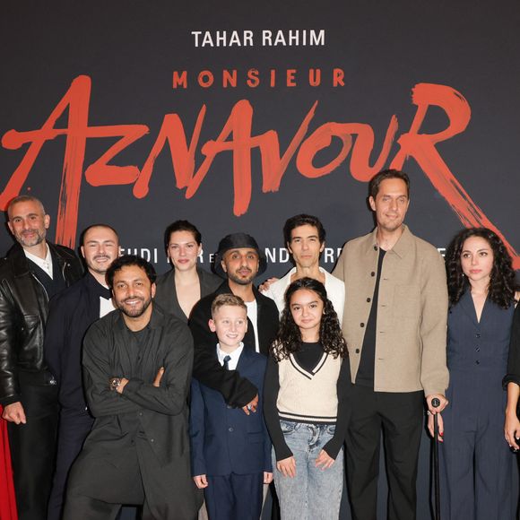 Jean-Rachid Kallouche (producteur), Bastien Bouillon, Mehdi Idir (réalisateur), Tahar Rahim, Grand Corps Malade ( GCM, Fabien Marsaud) et Marie-Julie Baup lors de l'avant-première du film "Monsieur Aznavour"  au cinéma Le Grand Rex à Paris le 22 octobre 2024.

© Coadic Guirec / Bestimage