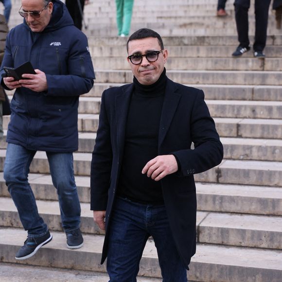 Brahim Asloum quittant la cérémonie funéraire de Rolland Courbis à l'église de la Madeleine à Paris, France, le 14 janvier 2026. Rolland Courbis, ancien footballeur français, entraîneur et commentateur médiatique au franc-parler, est décédé à l'âge de 72 ans. Photo par Jerome Domine/ABACAPRESS.COM