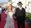 L'actrice portait une longue robe blanche tandis que le musicien avait opté pour un look sombre et élégant.

Sandrine Bonnaire et Erik Truffaz - Arrivées des personnalités sur le tapis rouge lors de la 40e édition du Festival de Cabourg « Journées romantiques » le 12 juin 2026

© Coadic Guirec / Bestimage