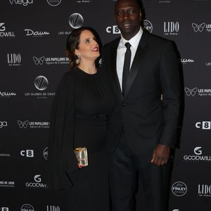 Omar Sy et sa femme Hélène au photocall de la 11ème cérémonie des Globes de Cristal au Lido à Paris le 30 janvier 2017. © CVS / Bestimage