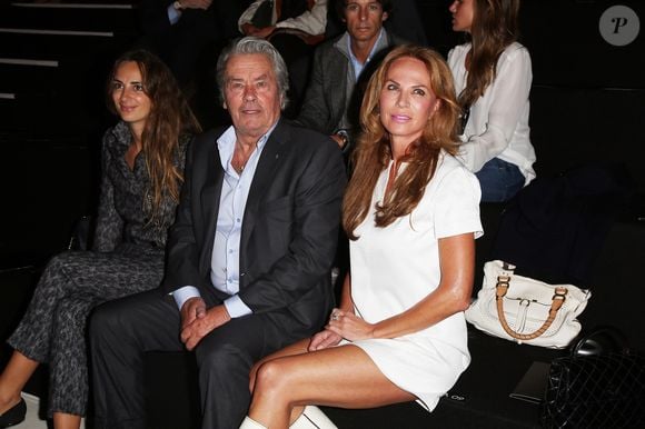 Alexia Niedzielski, Alain Delon et Rosalie Van Breemen au defilé de mode Elie Saab, collection prêt-à-porter printemps-été 2013, Paris le 03 octobre 2012. © Bestimage