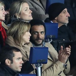 Maxim Nucci et sa compagne Isabelle Ithurburu enceinte assistent au huitième de finale retour de Ligue des Champion, du Paris Saint-Germain contre le Real Madrid au Parc des Princes à Paris le 6 mars 2018. © Cyril Moreau/Bestimage
