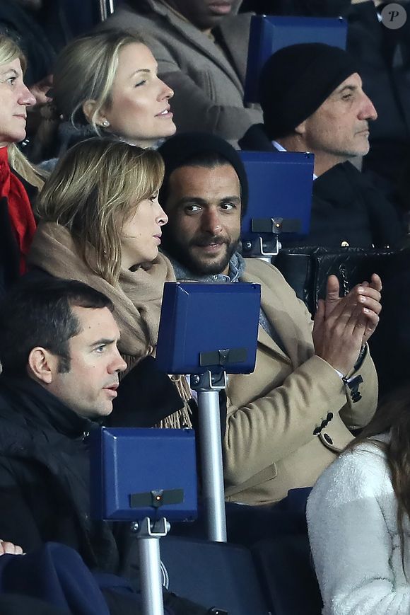 Maxim Nucci et sa compagne Isabelle Ithurburu enceinte assistent au huitième de finale retour de Ligue des Champion, du Paris Saint-Germain contre le Real Madrid au Parc des Princes à Paris le 6 mars 2018. © Cyril Moreau/Bestimage