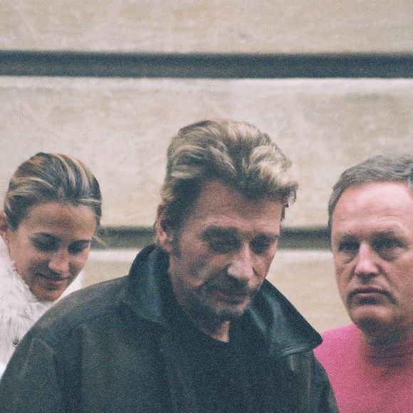 Exclusif - Johnny Hallyday avec André Boudou, le père de Laeticia et sa compagne à Paris. Le 13 décembre 2005 © Agence Bestimage
