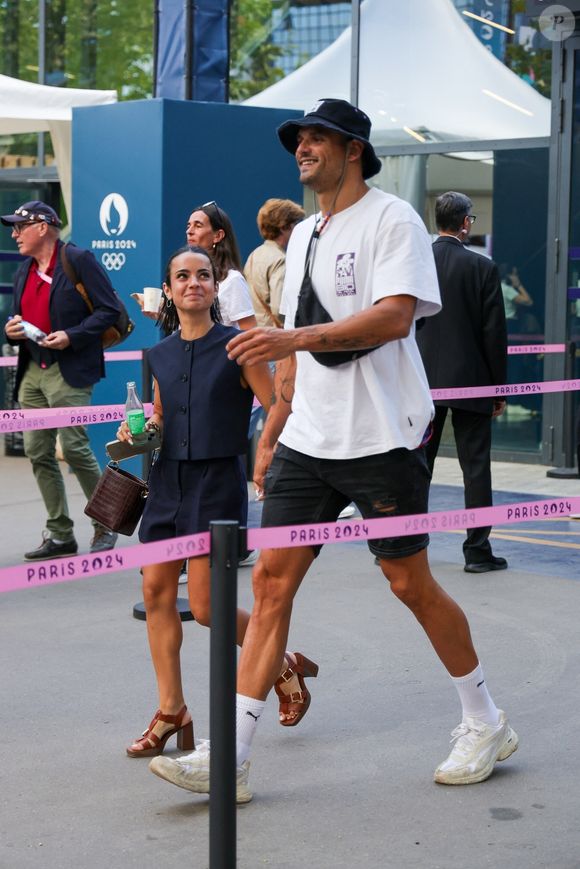 Paris, FRANCE  - Florent Manaudou and Lola Dumenil hand in hand at the France Germany basketball semi-final Olympic Games Paris 2024 in Paris, France.



Pictured: Florent Manaudou, Lola Dumenil