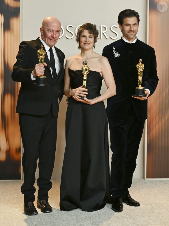 March 2, 2025, Los Angeles, California, USA: (L-R) Jacques Audiard, Camille and ClÃ©ment Ducol, winners of the Best Original Song for â€œEmilia Perezâ€ in the Press Room during the 97th Academy Awards, presented by the Academy of Motion Picture Arts and Sciences (AMPAS), at the Dolby Theatre in Hollywood. (Credit Image: © Billy Bennight/ZUMA Press Wire)