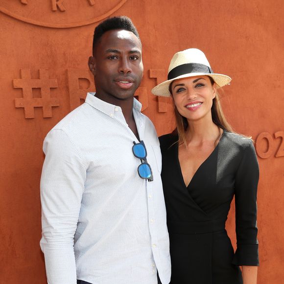 En effet, Fulgence Ouedraogo a pris la parole. 

Ariane Brodier et son compagnon Fulgence Ouedraogo au village lors des internationaux de tennis de Roland Garros à Paris le 5 juin 2017. © Cyril Moreau / Dominique Jacovides / Bestimage