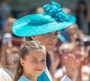 Une coiffure très similaire à celle de la fille de Kate Middleton et du prince William lors de la cérémonie Trooping The Colour qui avait elle-aussi opté pour une demi-queue de cheval haute. 

La princesse de Galles Cathrerine et la princesse Charlotte sont vues dans le Mall pendant le défilé du Trooping of the Colour, le 14 juin 2025, à Londres, Royaume-Uni. Photo par Tayfun Salci/ZUMA Press Wire/ABACAPRESS.COM