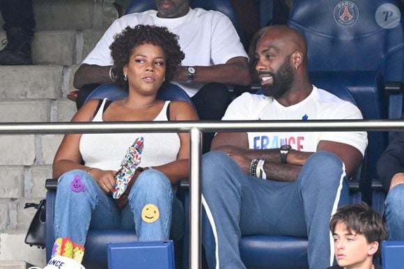 Teddy Riner et sa femme Luthna Plocus en tribunes pendant l'épreuve finale de football opposant la France à l'Espagne lors des Jeux Olympiques de Paris 2024 (JO) au Parc des Princes, à Paris, France, le 9 août 2024. © Jacovides-Perusseau/Bestimage