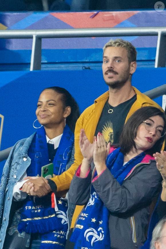 M. Pokora (Matt Pokora), sa femme Christina Milian assistent au match de la 5ème et avant-dernière journée de Ligue des nations entre la France et l'Autriche (2-0) au Stade de France à Saint-Denis le 22 septembre 2022. AGENCE / BESTIMAGE