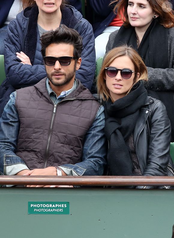 Maxim Nucci (Yodelice) et sa compagne Isabelle Ithurburu dans les tribunes des Internationaux de France de tennis de Roland Garros à Paris. Le 24 mai 2016 
© Dominique Jacovides / Bestimage