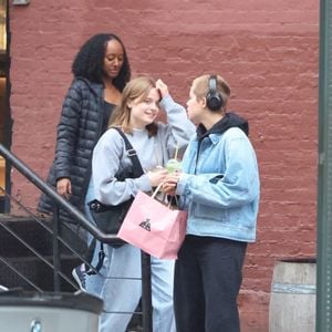 New York, NY  - EXCLUSIVE  - Angelina Jolie's children, Shiloh Nouvel, Vivienne Marcheline, and Zahara Marley Jolie-Pitt, were seen exploring the vibrant streets of Soho. Shiloh sported a blue denim jacket, black pants, and black shoes, while Vivienne opted for a grey sweatshirt, light blue jeans, and white sneakers, complemented by a black sling bag. Zahara completed the trio's stylish appearance with a chic black top, blue jeans, a black belt, and white sneakers.



Pictured: Shiloh Jolie-Pitt, Vivienne Jolie-Pitt, Zahara Marley Jolie