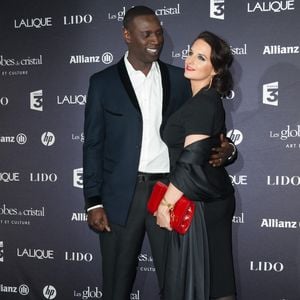 Omar Sy et son épouse assistent à la 7ème cérémonie des Globes de Cristal qui se tient au Lido sur les Champs Elysées à Paris, France, le 6 février 2012. Photo ABACAPRESS.COM