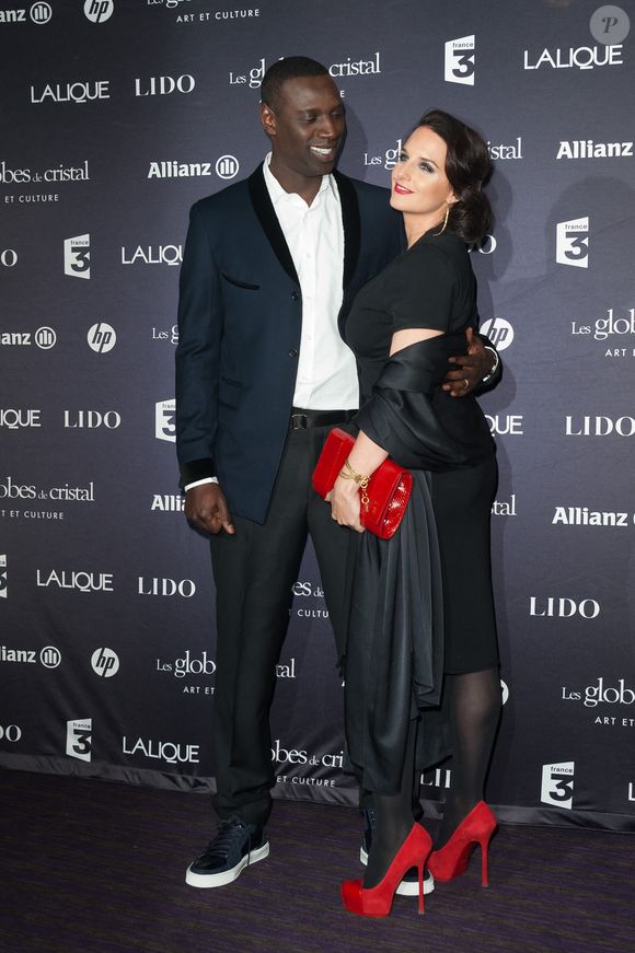 Omar Sy et son épouse assistent à la 7ème cérémonie des Globes de Cristal qui se tient au Lido sur les Champs Elysées à Paris, France, le 6 février 2012. Photo ABACAPRESS.COM