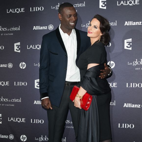 Omar Sy et son épouse assistent à la 7ème cérémonie des Globes de Cristal qui se tient au Lido sur les Champs Elysées à Paris, France, le 6 février 2012. Photo ABACAPRESS.COM