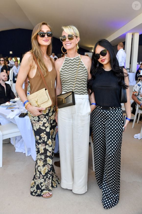 Exclusif -  Mathilde Pinault, Laeticia Hallyday et sa fille Joy dans l'Espace VIP lors de la 9ème édition du "Longines Paris Eiffel Jumping" au Champ de Mars à Paris, France, le 25 juin 2023. © Perusseau-Veeren/Bestimage