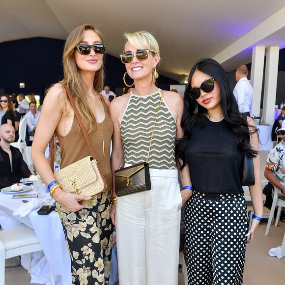 Exclusif -  Mathilde Pinault, Laeticia Hallyday et sa fille Joy dans l'Espace VIP lors de la 9ème édition du "Longines Paris Eiffel Jumping" au Champ de Mars à Paris, France, le 25 juin 2023. © Perusseau-Veeren/Bestimage