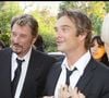 Il reprendra un titre phare de son père "L'Envie"
Johnny, David et Laeticia Hallyday - soirée pour la remise des insignes d'officier dans l'ordre de la légion d'honneur (archive)
©DOMINIQUE JACOVIDES / BESTIMAGE