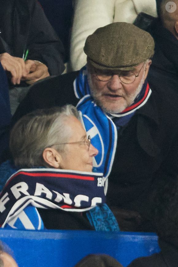 Élisabeth Borne, Ministre d'État, ministre de l’Éducation nationale, de l’Enseignement supérieur et de la Recherche, et son ami Patrice Obert en tribunes lors du match du Tournoi des Six Nations opposant la France à l'Écosse (35-16) au Stade de France à Saint-Denis, Seine Saint-Denis, France, le 15 mars 2025. © Christian Liewig/Bestimage
