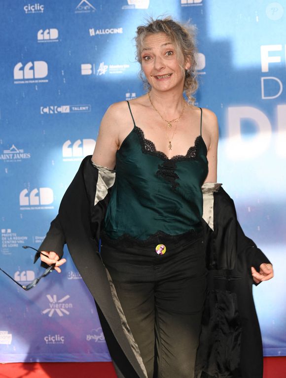 Elle y vit entourée d’artistes et de proches, loin du tumulte médiatique.

Corinne Masiero (présidente du jury) au photocall du jury de la première édition du film de demain (FFD) au Ciné Lumière de Vierzon. © Coadic Guirec / Bestimage