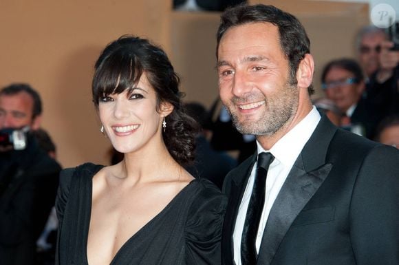 Mélanie Doutey et Gilles Lellouche arrivent pour la projection de 'The Artist' présenté en compétition dans la section Longs métrages dans le cadre du 64ème Festival International du Film de Cannes, au Palais des Festivals à Cannes, sud de la France, le 15 mai 2011. Photo by Nicolas Genin/ABACAPRESS.COM