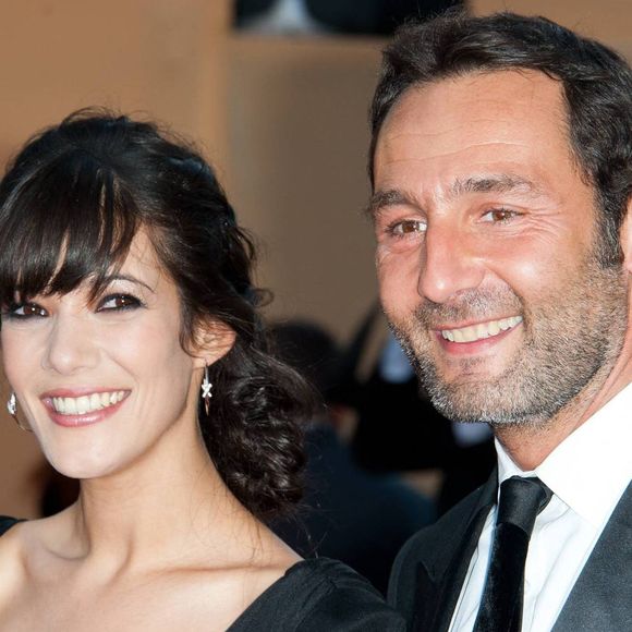 Mélanie Doutey et Gilles Lellouche arrivent pour la projection de 'The Artist' présenté en compétition dans la section Longs métrages dans le cadre du 64ème Festival International du Film de Cannes, au Palais des Festivals à Cannes, sud de la France, le 15 mai 2011. Photo by Nicolas Genin/ABACAPRESS.COM