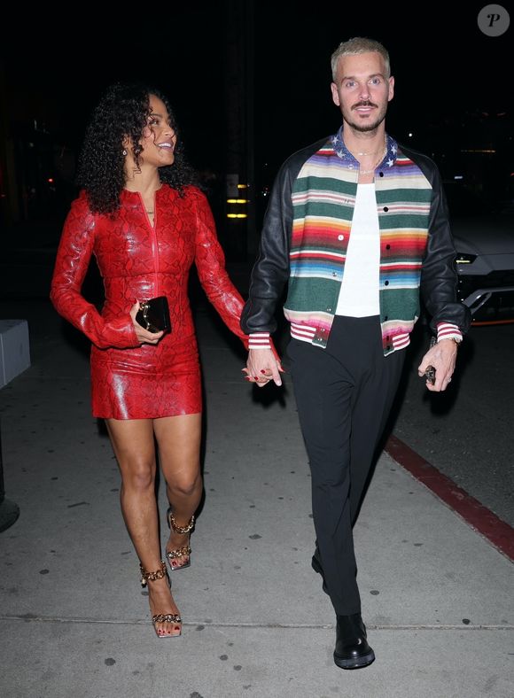 BGUK_2807586 – Los Angeles, Californie – Christina Milian est arrivée dîner dans une robe rouge à imprimé serpent, accompagnée de son mari Matt Pokora, au Catch Steak LA à West Hollywood. Backgrid UK / Bestimage.