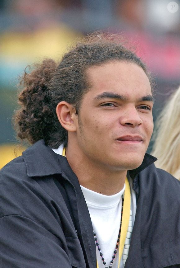 Joakim Noah, fils de la légende du tennis français Yannick Noah, réagit pendant le discours d'acceptation de son père lors de la cérémonie d'intronisation au Temple de la renommée du tennis 2005 qui s'est tenue à Newport, Rhode Island, le samedi 9 juillet 2005. Photo par Nicolas Khayat/ABACAPRESS.COM.