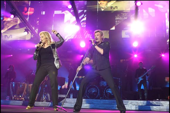 Sylvie Vartan et Johnny Hallyday lors de la tournée "Tour 66" au Stade de France. Photo par ANGELI-BORDE-JACOVIDES-RINDOFF / BESTIMAGE