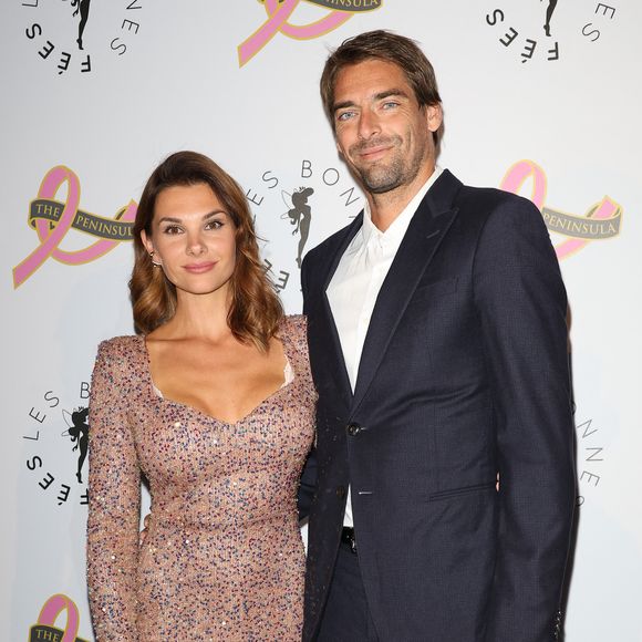 Camille Lacourt et sa compagne Alice Detollenaere (Miss Bourgogne 2010) - Photocall du 4ème gala de charité de l'association "Les Bonnes Fées" à l'occasion de la campagne mondiale "Octobre Rose" à l'hôtel Peninsula, Paris le 5 octobre 2023. © Coadic Guirec/Bestimage